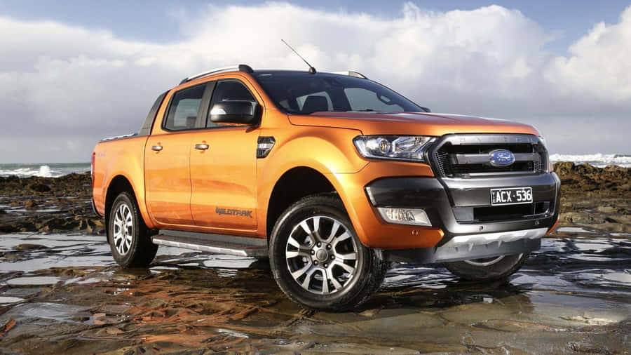 Powerful Ford Ranger Cruising On The Road Wallpaper