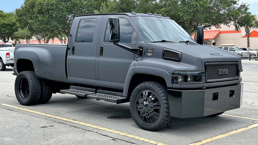 Powerful Gmc Topkick Truck On The Road Wallpaper