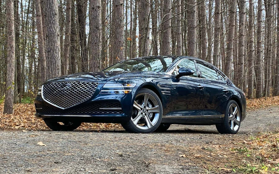 Premium Genesis G80 Cruising On The Road Wallpaper