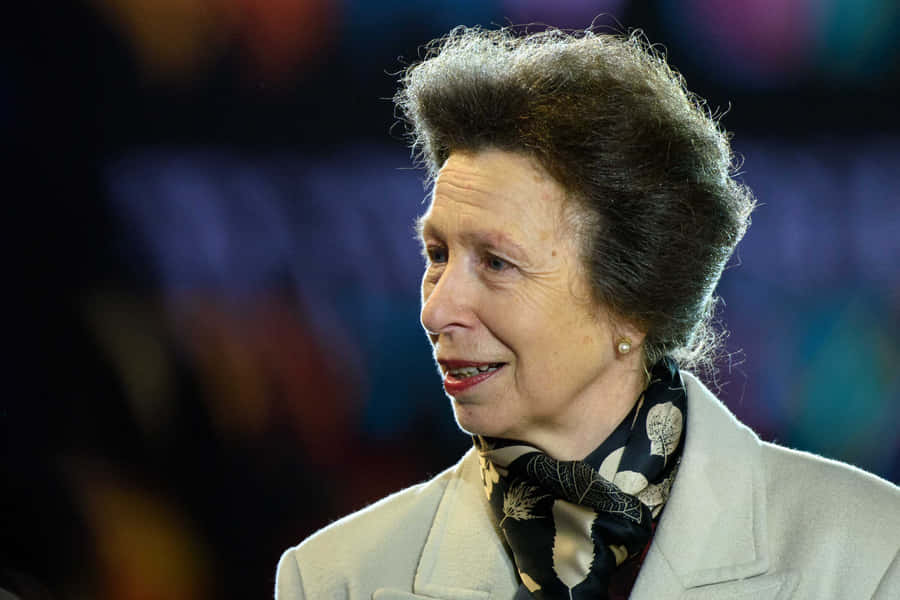 Princess Anne Wearing Beige Jacket With Scarf Wallpaper