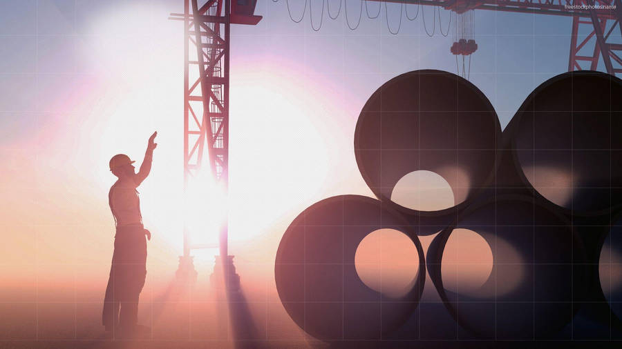 Professional Engineer At Work On A Construction Site Wallpaper