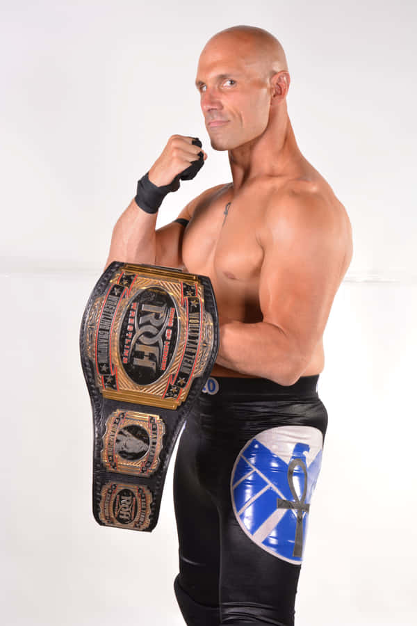 Professional Wrestlerwith Championship Belt Wallpaper