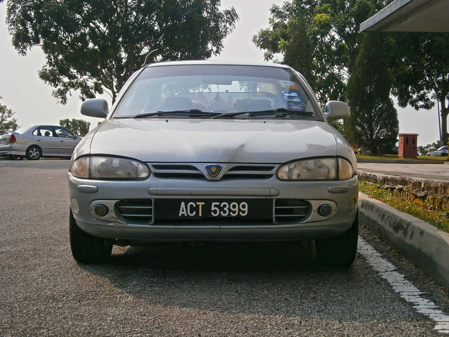 Proton Wira Parked Outdoors Wallpaper
