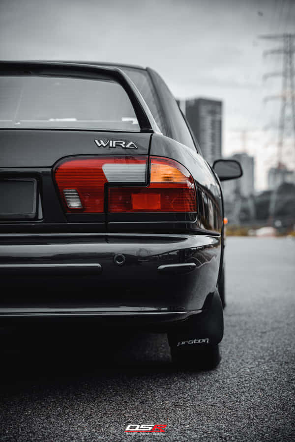 Proton Wira Rear View Urban Backdrop Wallpaper