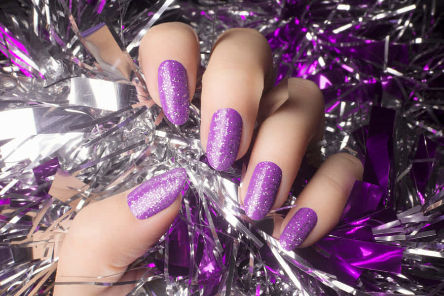 Purple Glitter Nail Polishon Tinsel Background Wallpaper