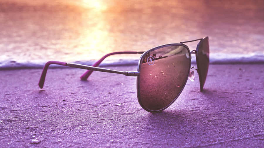 Purple Tinted Sunglasseson Pavement Wallpaper