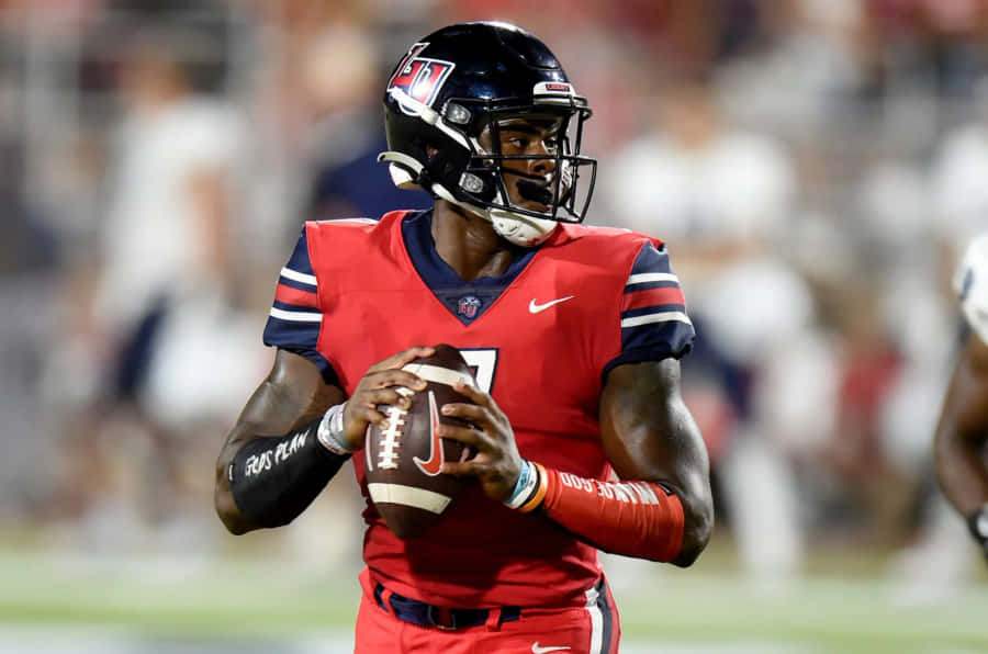 Quarterback Malik Willis Action Shot Wallpaper