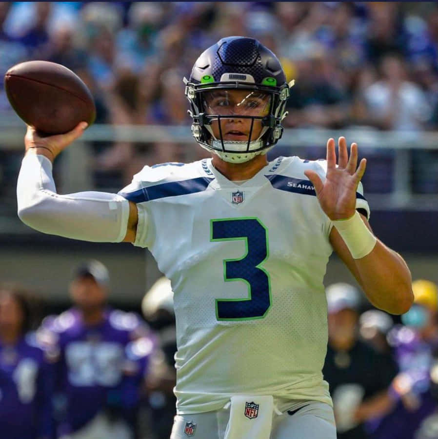 Quarterback Throwing Football Game Wallpaper