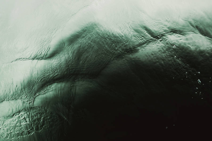 Quiet Oasis Of Dark Green Sea Water Wallpaper