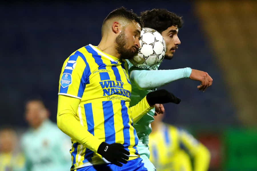 R K C Waalwijk Intense Football Match Moment Wallpaper