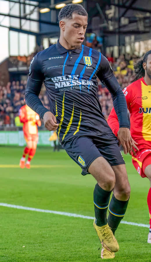 R K C Waalwijk Player In Action During Match Wallpaper
