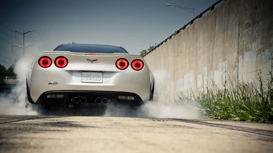 Radiant Chevrolet Corvette Zr1 Unleashed On Road Wallpaper
