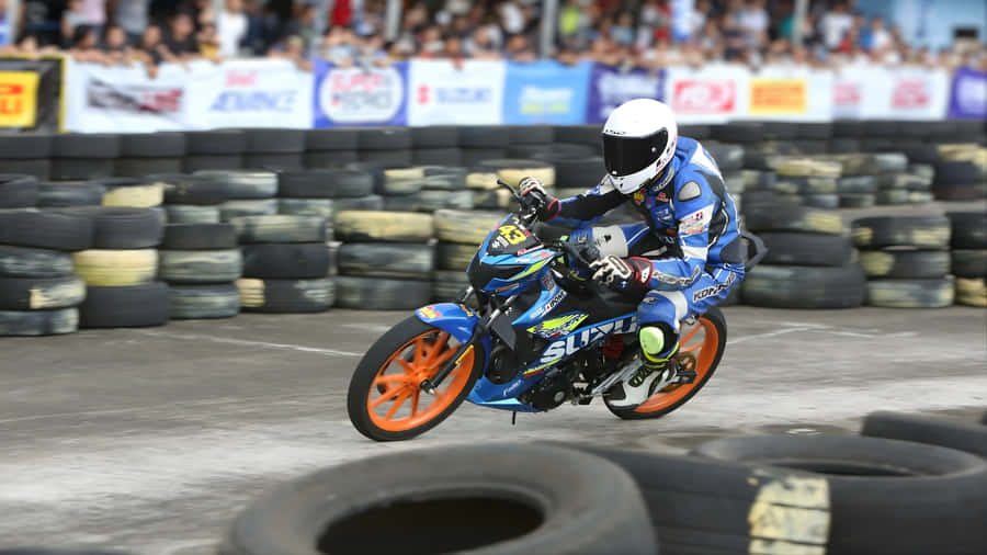 Raider 150 Fi Racing Action Wallpaper