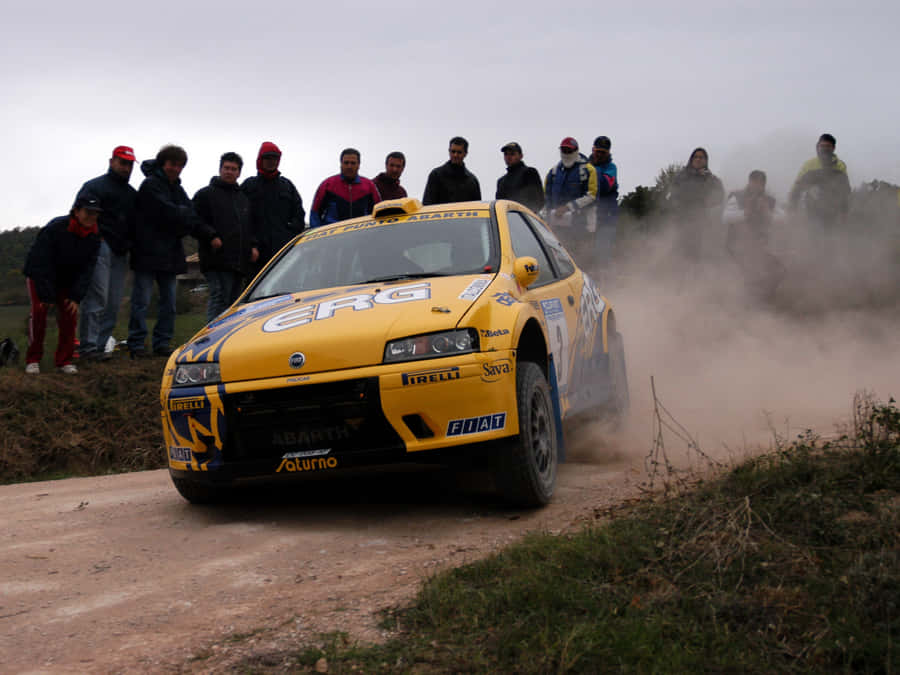 Rally_ Car_ Drift_on_ Dirt_ Road Wallpaper