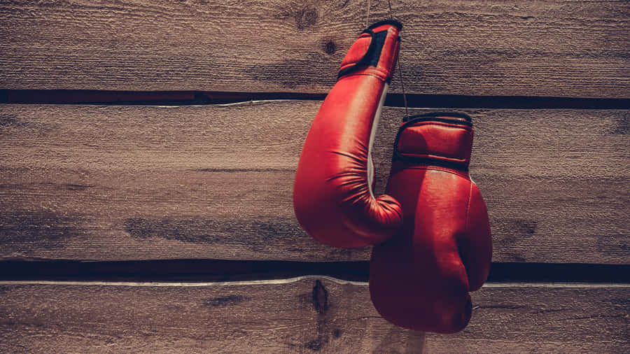 Red Boxing Gloves Hanging Wooden Background Wallpaper