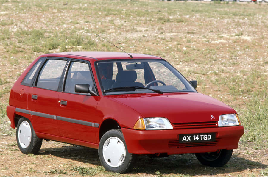 Red Citroen A X14 T G D Parked Outdoors Wallpaper