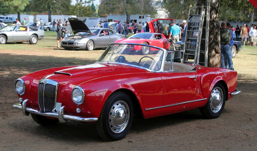 Red Lancia Aurelia Convertibleat Car Show Wallpaper