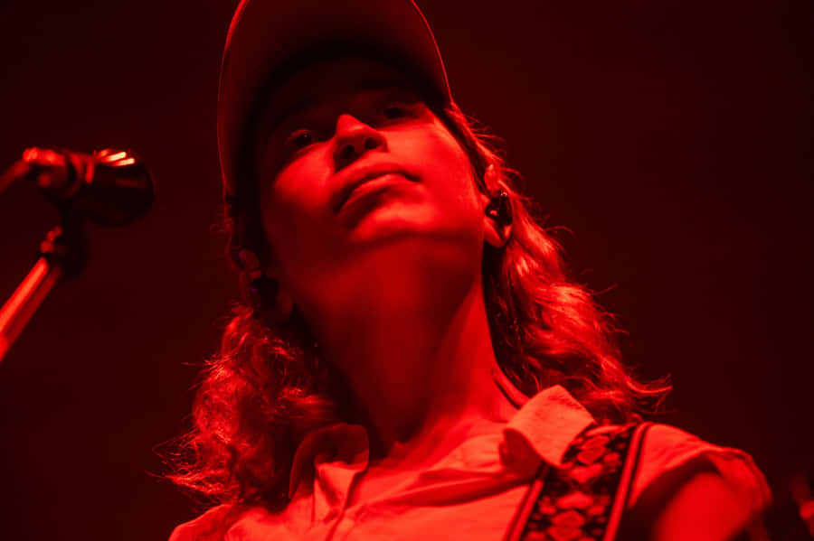 Red Lit Performance Singer Wallpaper