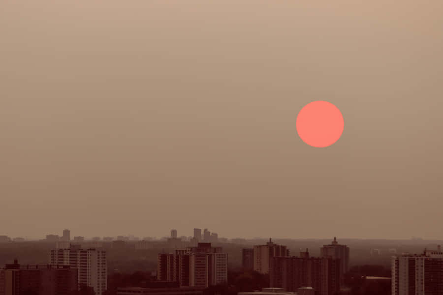 Red Moon Over Cityscape Wallpaper