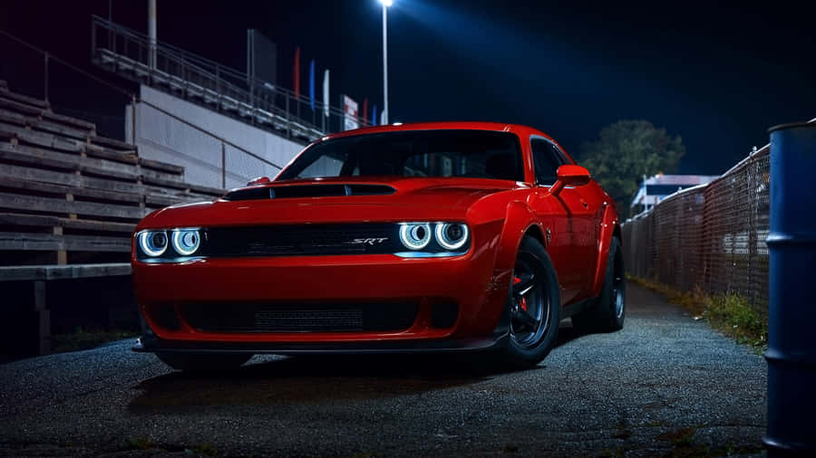 Red S R T Muscle Car Night Scene Wallpaper