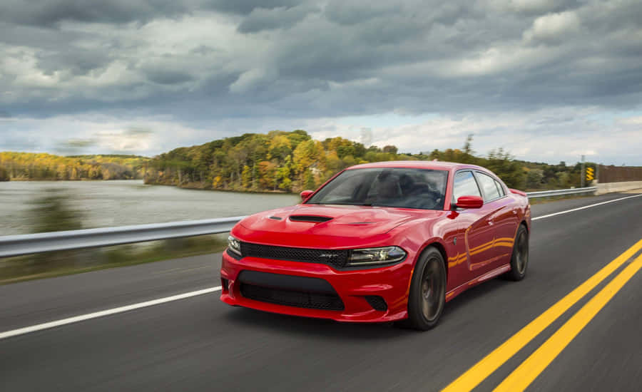 Red Sports Car Speeding On Highway Wallpaper