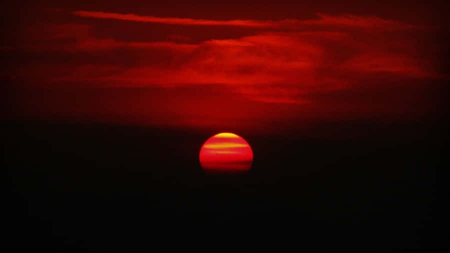 Red Sunset Over The Water Wallpaper