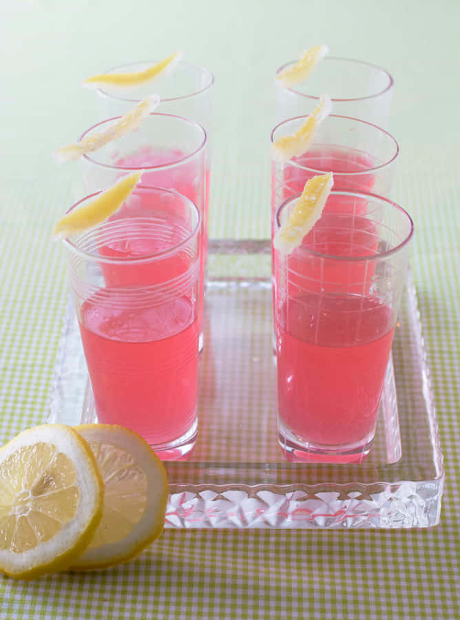 Refreshing Glass Of Pink Lemonade On A Sunny Day Wallpaper