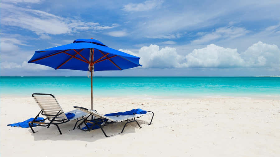 Relaxing Beach Sunbed With A Stunning Ocean View Wallpaper