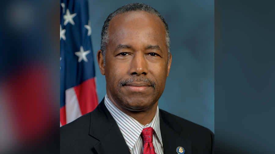 Renowned American Neurosurgeon Dr. Ben Carson In Formal Attire Wallpaper