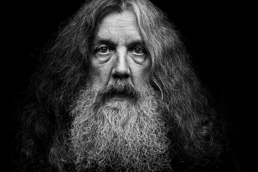 Renowned British Comic Book Author Alan Moore At A Public Event Wallpaper