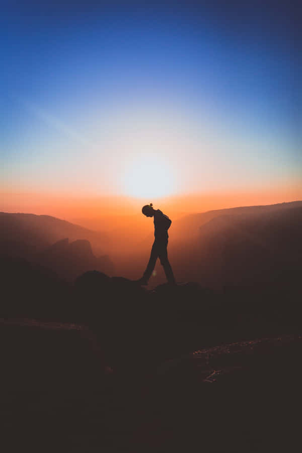 Resilient Person Standing Alone Wallpaper