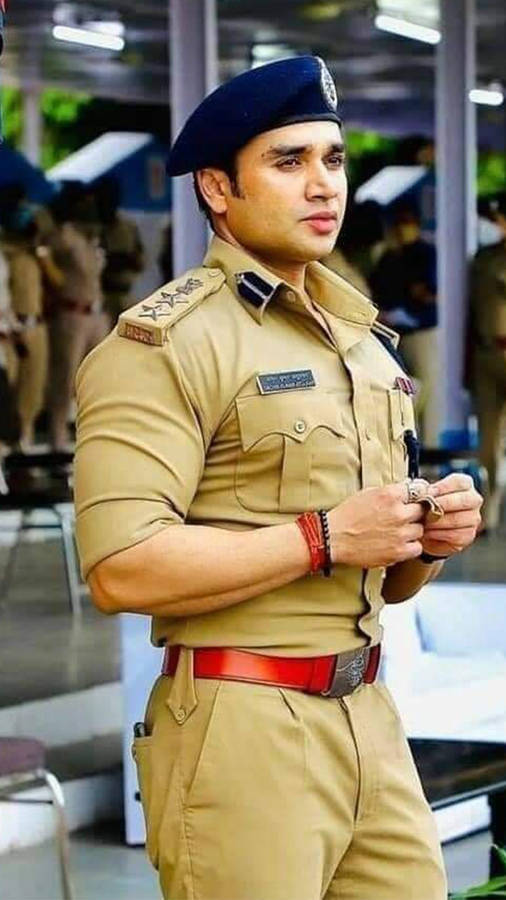 Resolute Indian Police Officer In Uniform Wallpaper