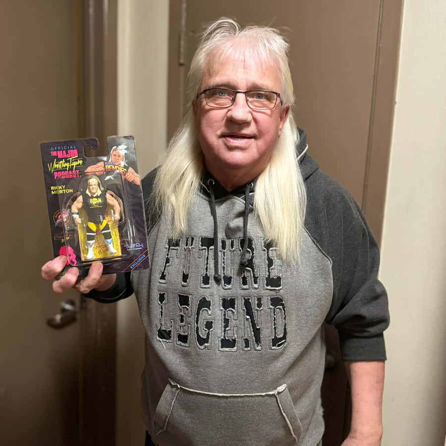 Ricky Morton Holding Action Figure Wallpaper