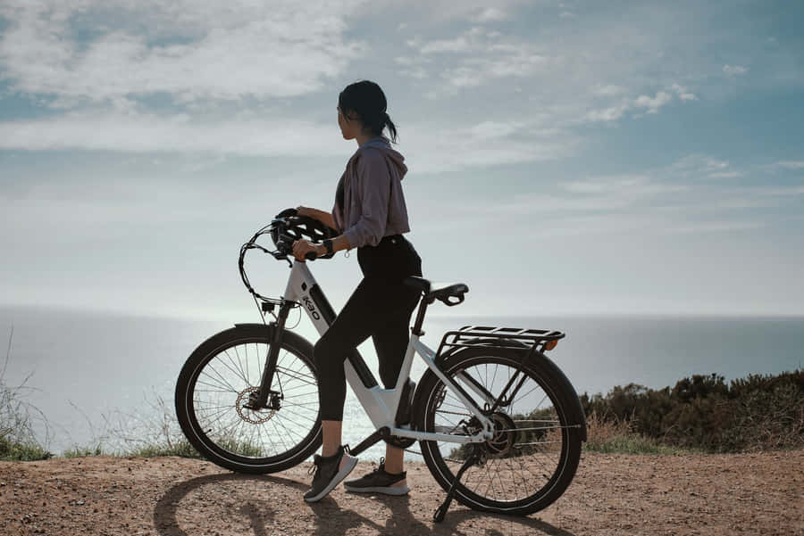 Riding An Electric Bike On A Scenic Route Wallpaper