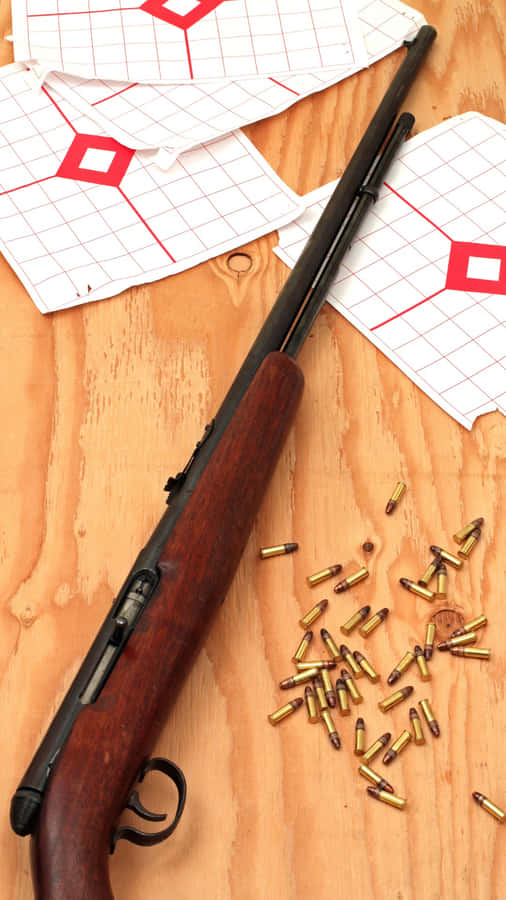 Rifleand Ammunitionon Wooden Background Wallpaper