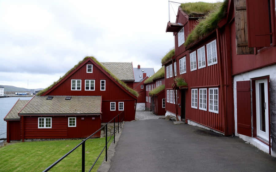 Road In Between Red Houses In Thorshavn Wallpaper