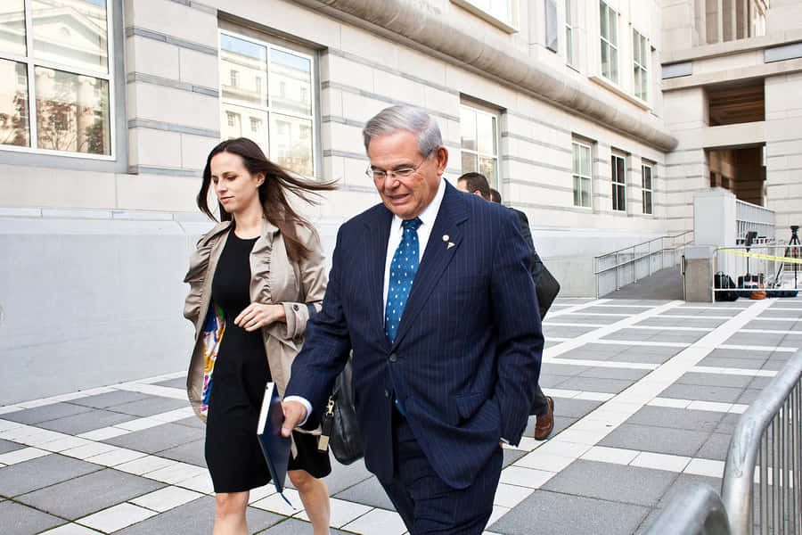 Robert Menendez Walking With Daughter Wallpaper