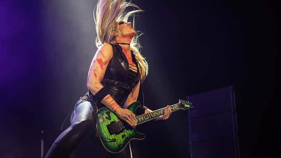Rock Guitarist Performance Energy Wallpaper
