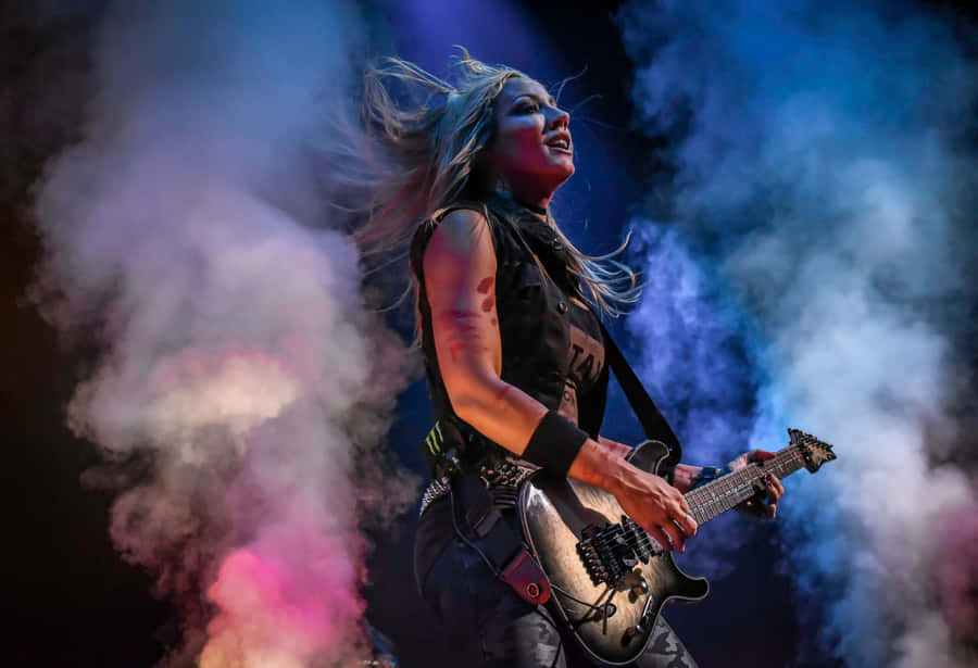 Rock Guitarist Performancein Smoke Wallpaper