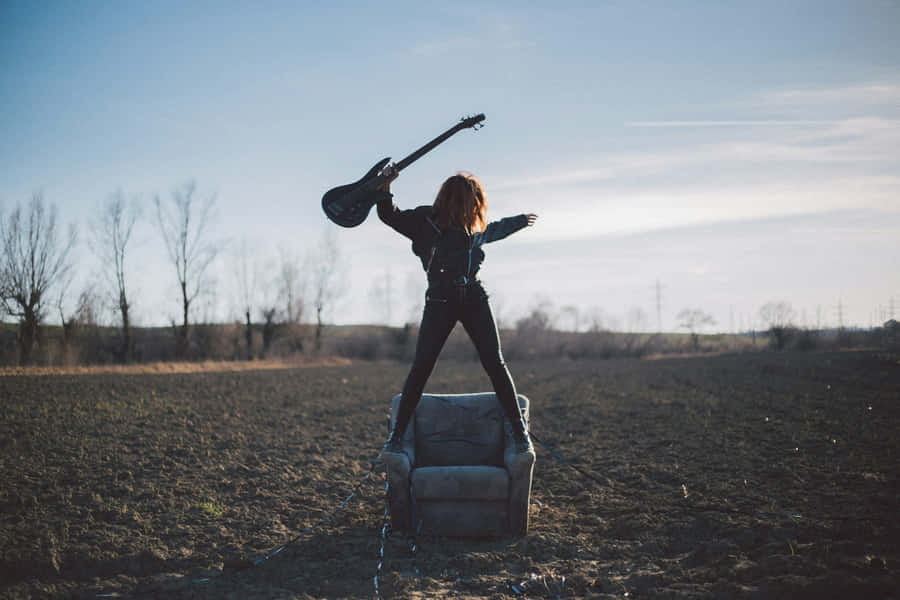 Rock Rebellion Sunset Guitarist.jpg Wallpaper