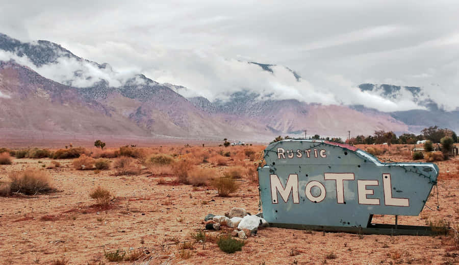 Rustic Motel Vintage Sign Desert Landscape Wallpaper