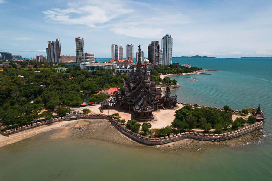Sanctuary Of Truth By The Beach In Thailand Wallpaper