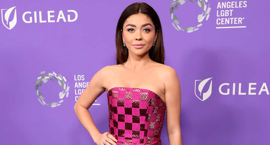 Sarah Hyland Posing Stylishly During A Photoshoot. Wallpaper