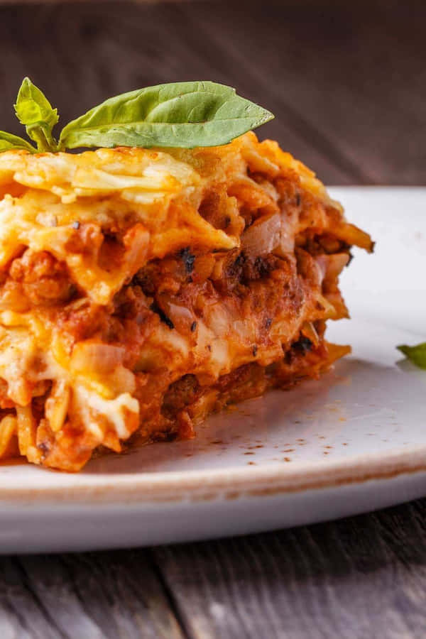 Satisfying Slice Of Authentic Lasagna Alla Bolognese Wallpaper