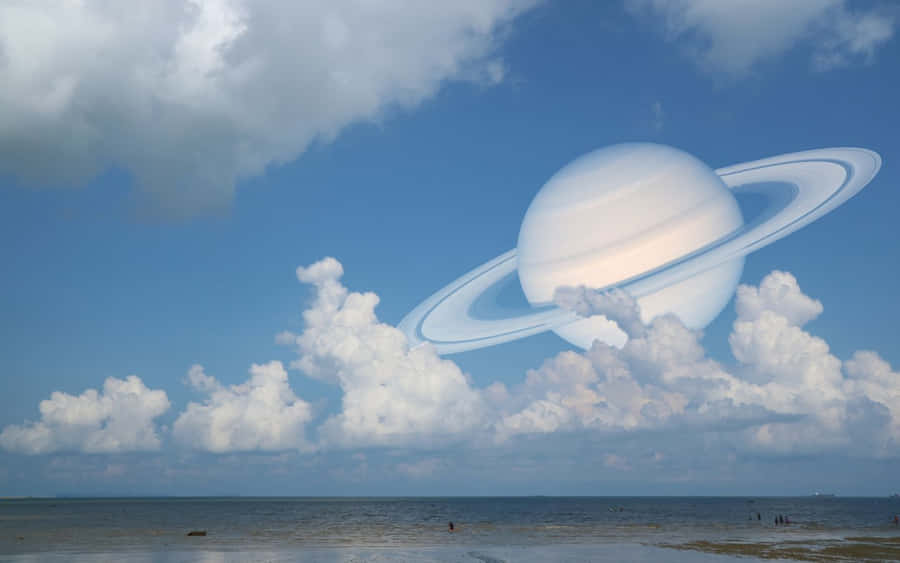 Saturn In The Sky With Clouds Wallpaper