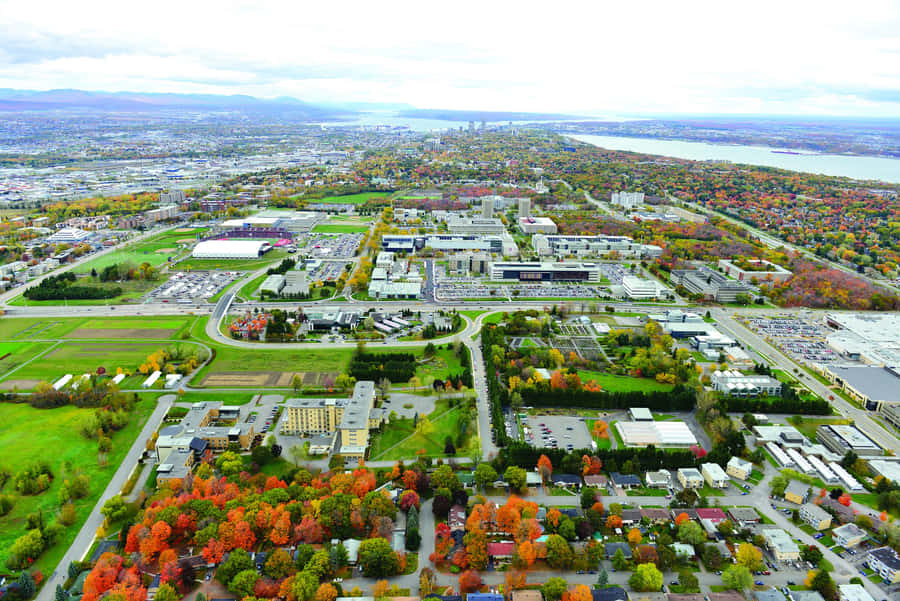 Scenic View Of Laval Cityscape During A Vibrant Sunset Wallpaper