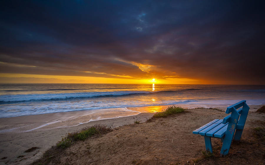 Seaside Bench At Sunset Wallpaper