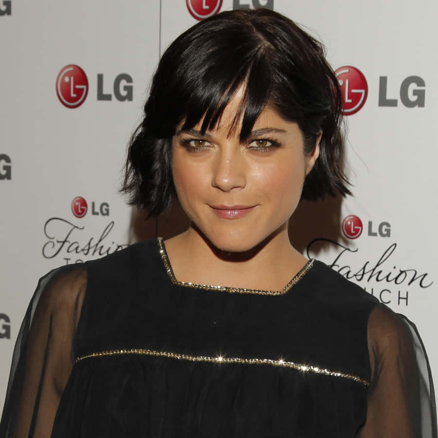 Selma Blair Wearing A Beautiful Black Dress With A White Background Wallpaper