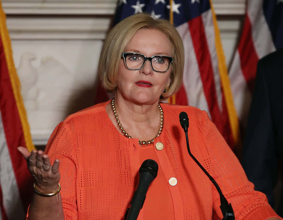Senator Claire Mccaskill Dressed In Peach Wallpaper