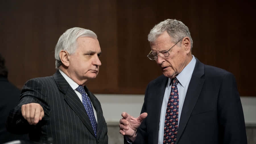 Senator Jim Inhofe And Jack Reed In Discussion Wallpaper